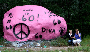 large rock is painted pink in honor of Barb's 60th birthday